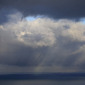 Light and clouds on sea, and far away islands.