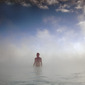 Man standing in geothermal lagoon